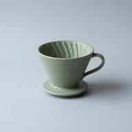 Studio product setup on a neutral grey backdrop, soft box light.
